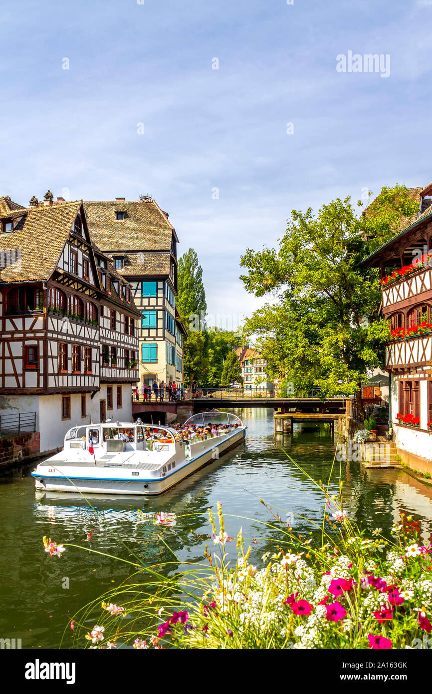 France, Strasbourg, Tour boat on Ill river in old town Stock Photo