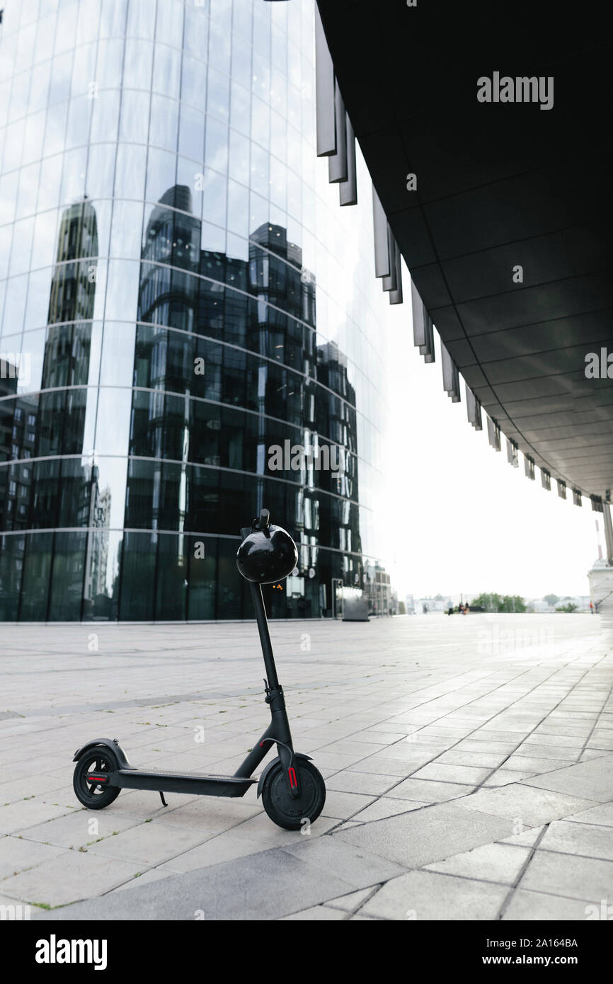 Electric scooter and helmet Stock Photo Alamy