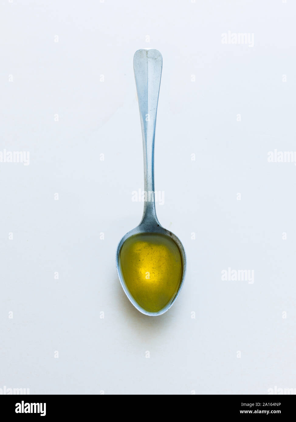 Spoon with olive oil Stock Photo Alamy