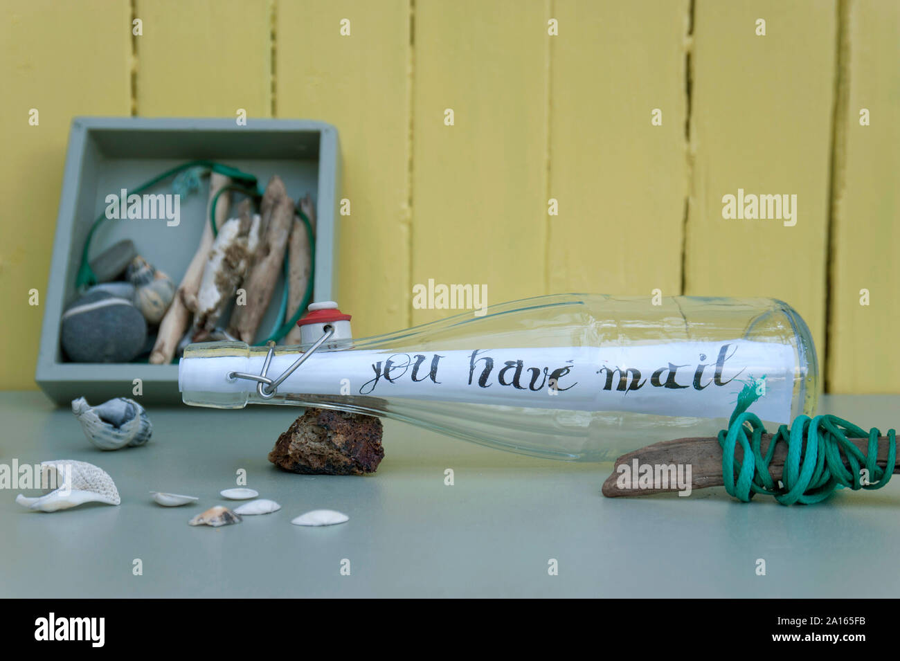 Message in a bottle and stranded goods Stock Photo