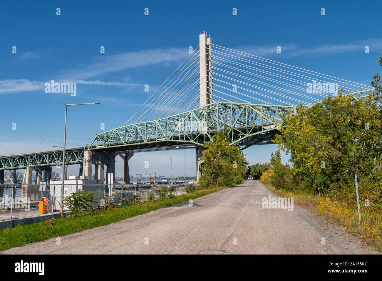 Montreal, Canada - 19 September 2019: New Champlain bridge next to Old Champlain Bridge from Petite Voie du Fleuve. Stock Photo