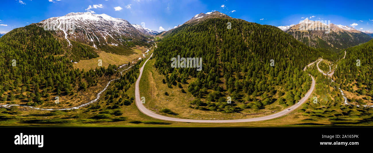 Scenic panorama of winding road across forested landscape of Defereggen Valley, East Tyrol, Austria Stock Photo