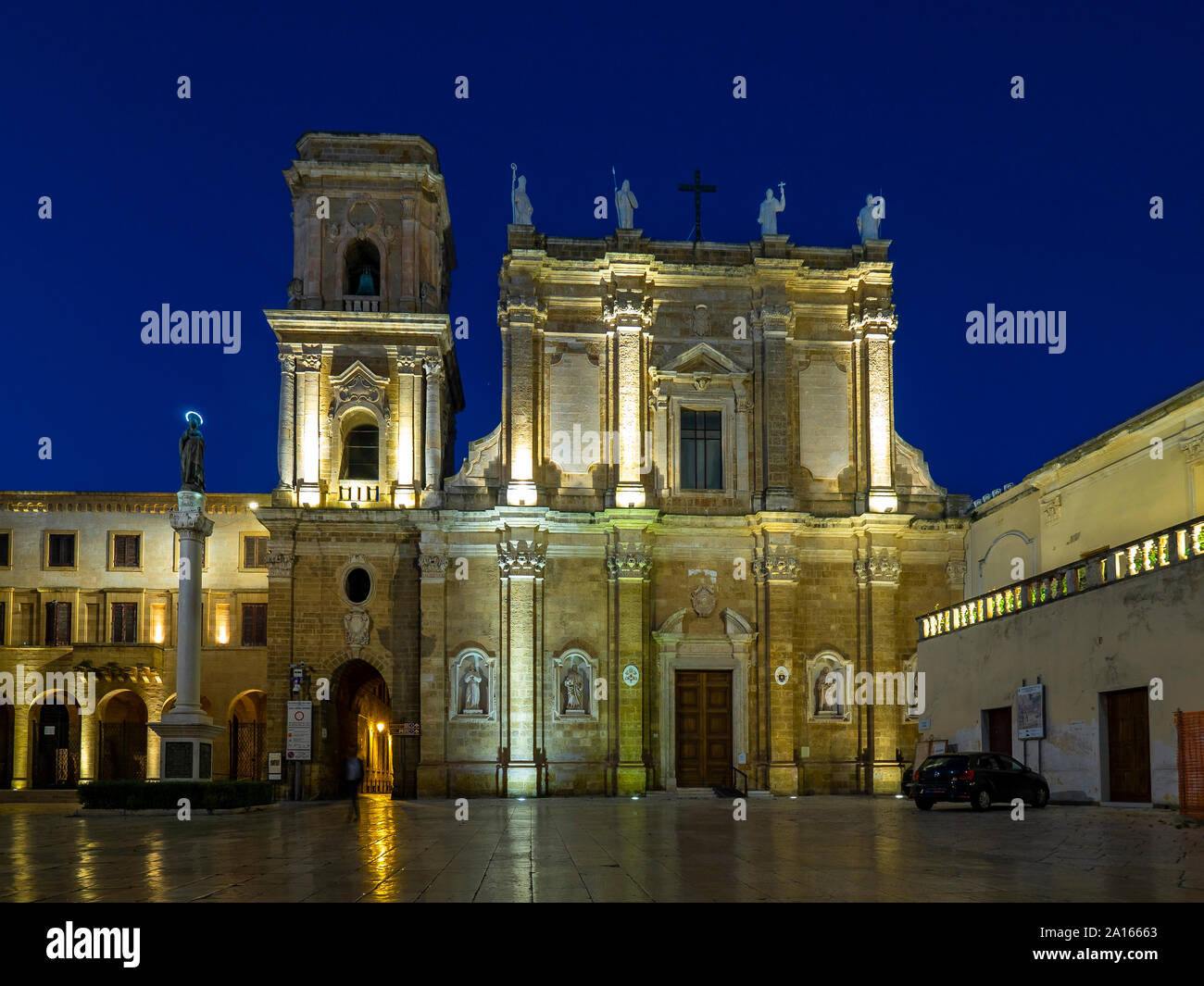 Facade of illuminated cathedral in Brindisi against clear sky at night Stock Photo