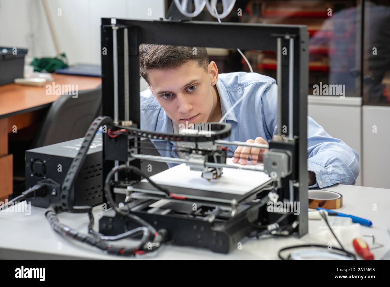 Student setting up 3D printer Stock Photo