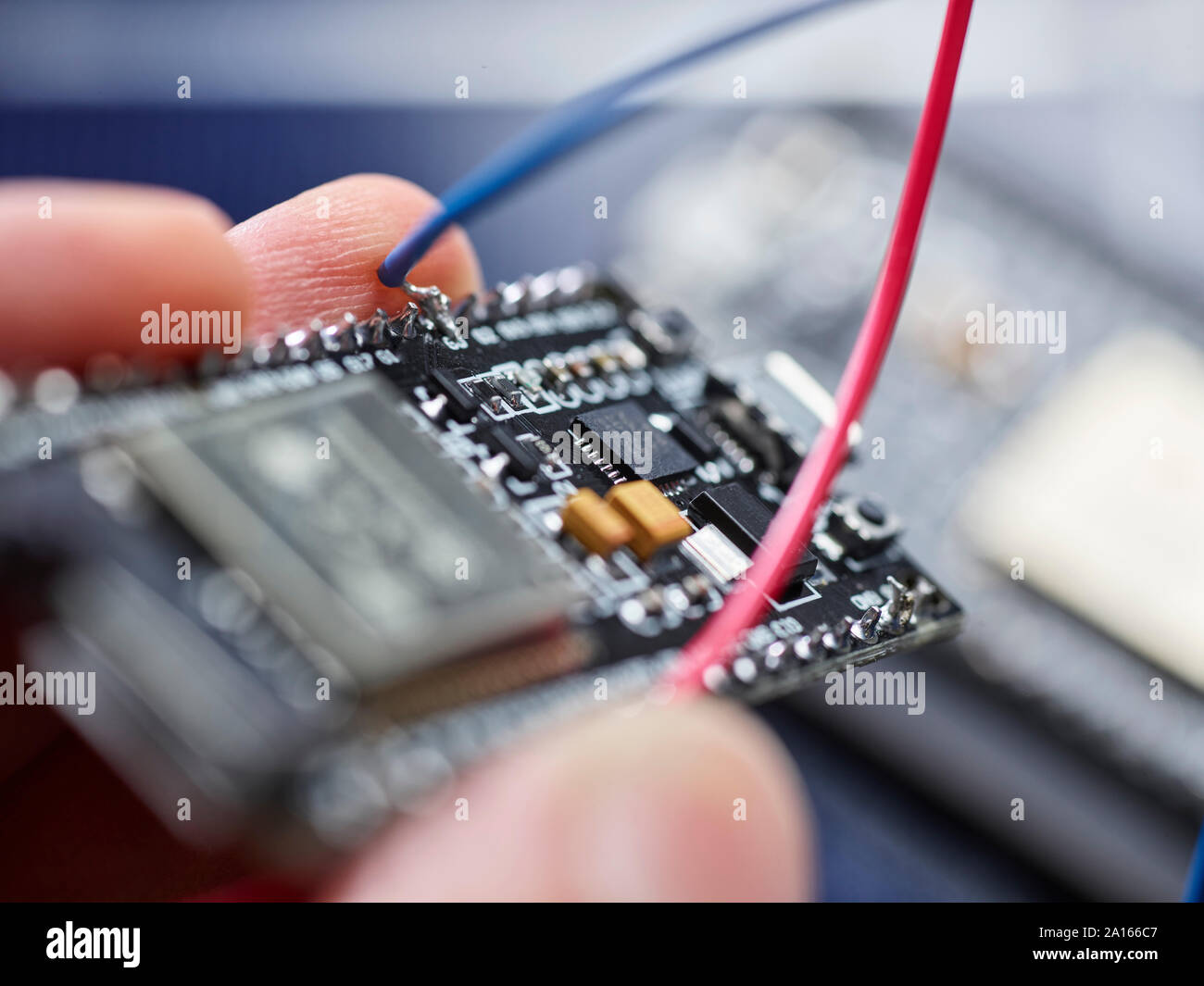Detail of hand holding circuit board Stock Photo