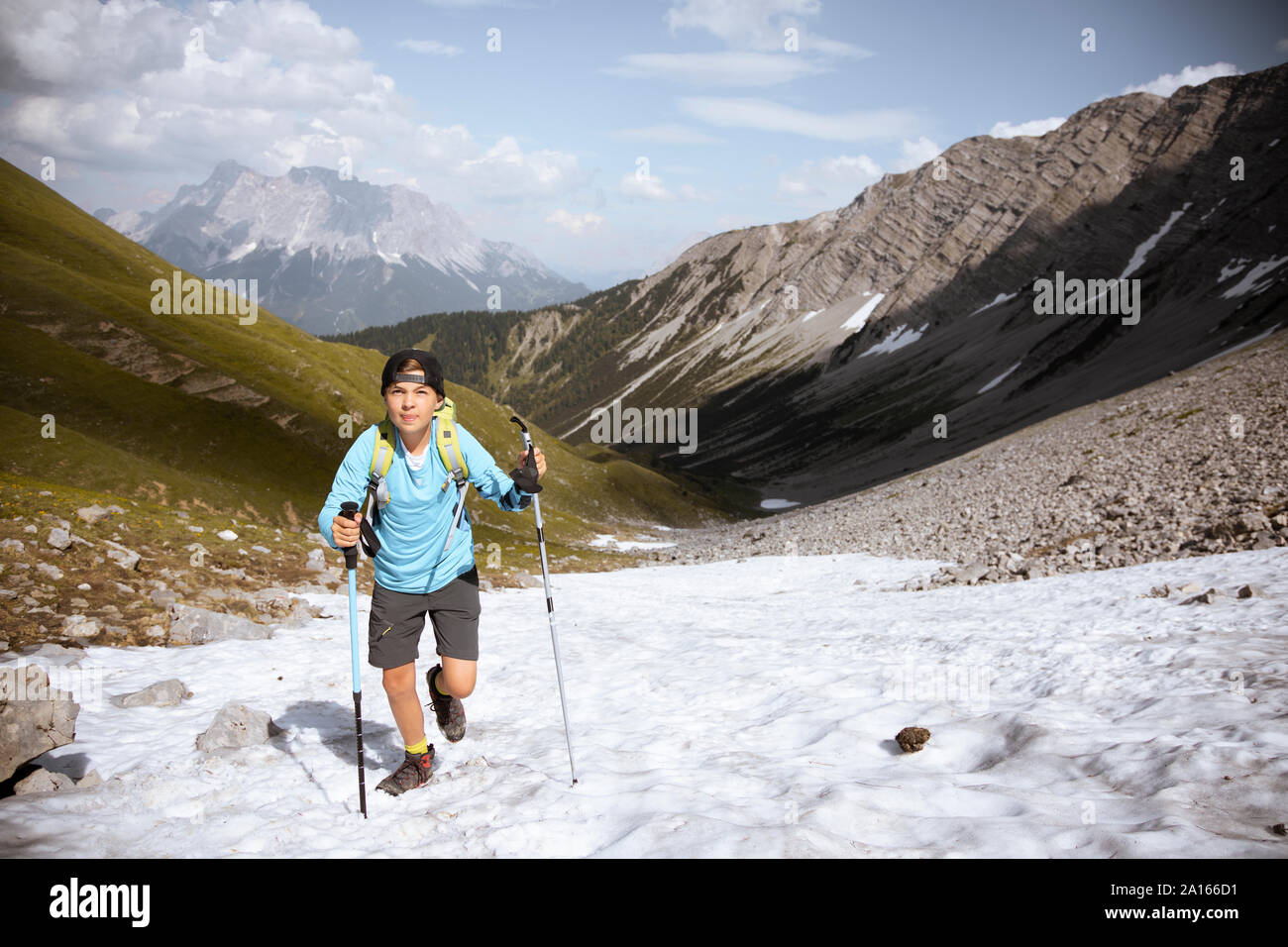 Boy hiking in the mountains Stock Photo