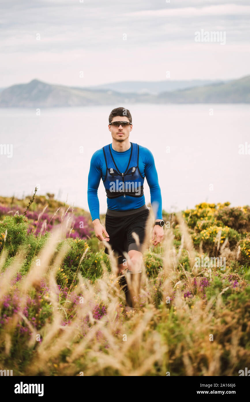 Portrait of trail runner in the mountains, Ferrol, Spain Stock Photo