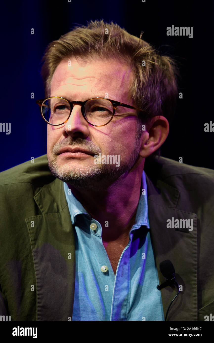 23 September 2019, Berlin: Florian Illies, managing publisher of Rowohlt  Verlag, sits on stage during the presentation of the autobiography of  fashion designer Wolfgang Joop "Die einzig mögliche Zeit" in the tipi