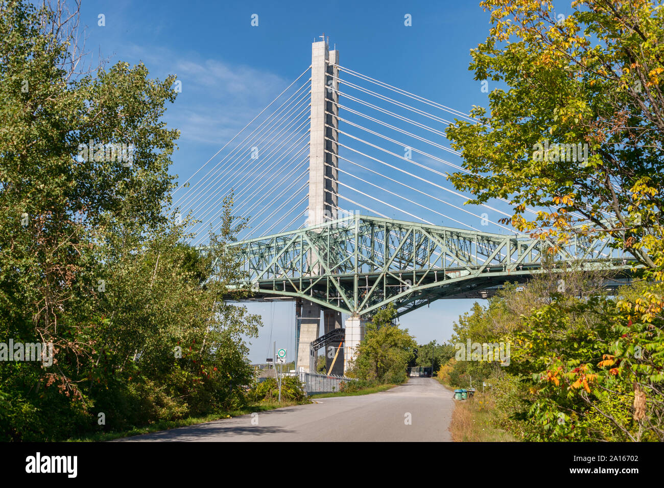 Montreal, Canada - 19 September 2019: New Champlain bridge next to Old Champlain Bridge from Petite Voie du Fleuve. Stock Photo