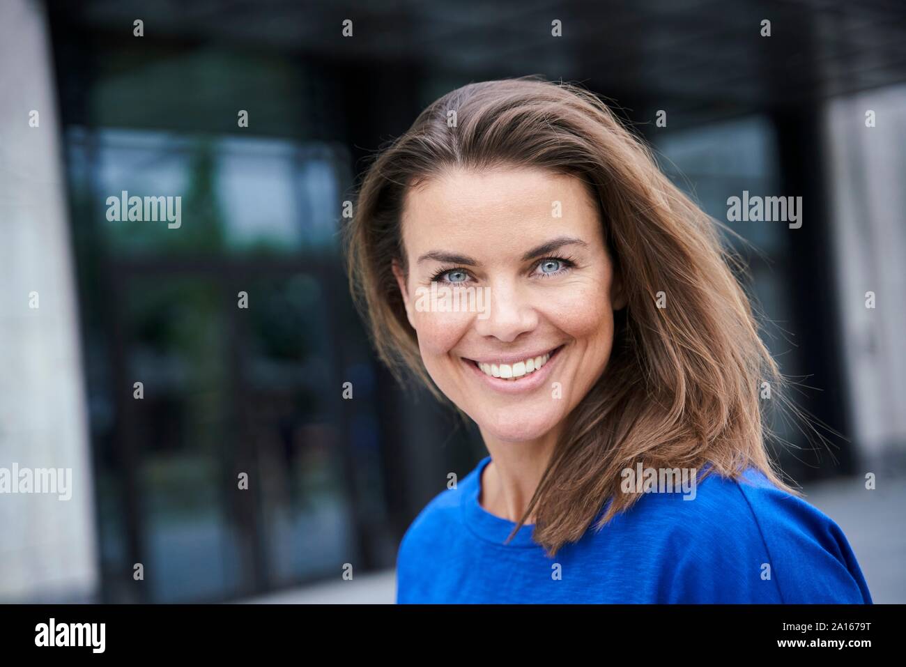 Beautiful woman in blue top hi-res stock photography and images - Alamy