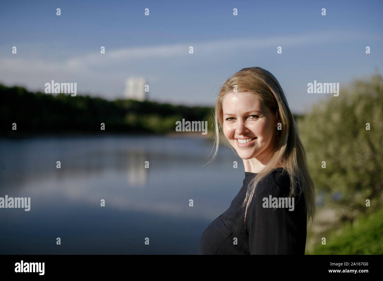 Portrait of a woman at the riverbank Stock Photo