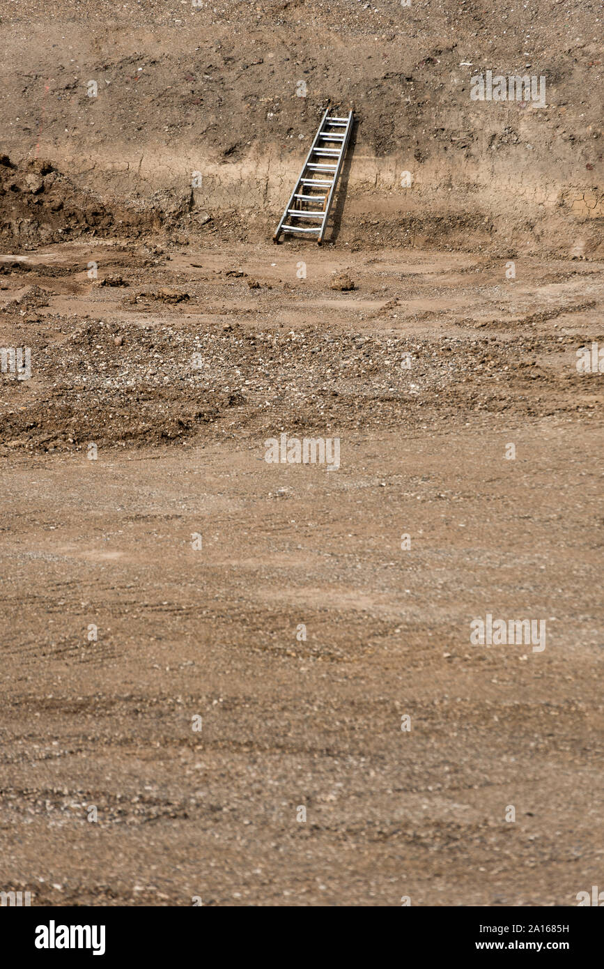 Ladder on land during sunny day Stock Photo
