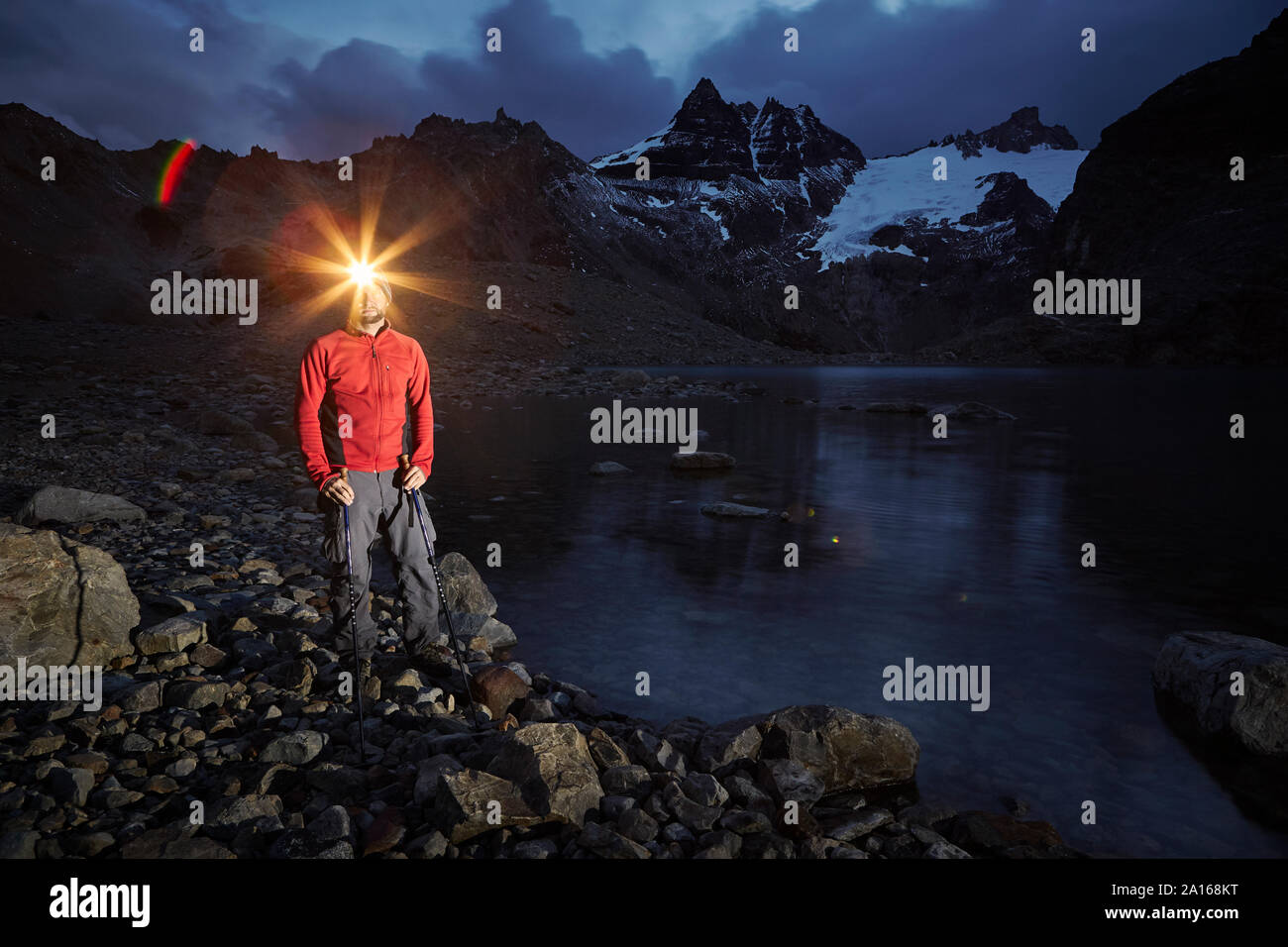 Hiker with headlamp standing at Lago de los Tres, Los Glaciares National Park, Patagonia, Argentina Stock Photo