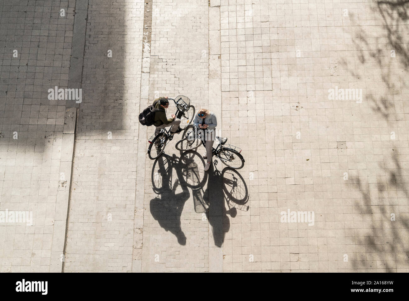 Top view of two people with bikes Stock Photo