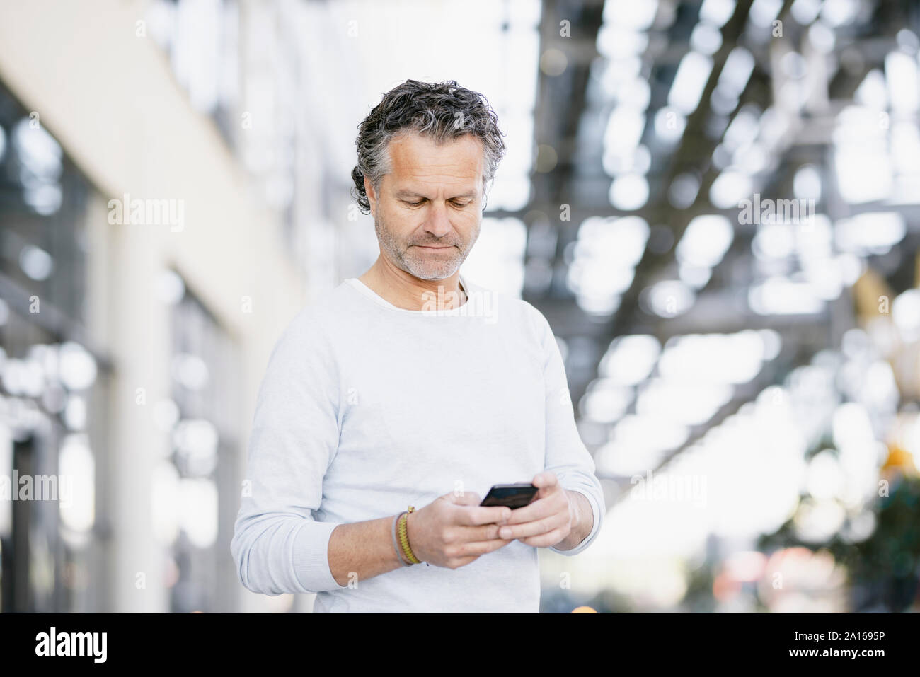 Portrait of mature man using smartphone Stock Photo