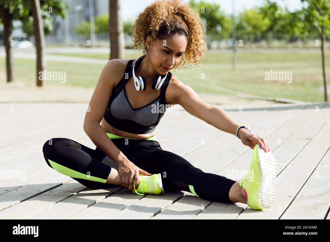 Sporty woman stretching in the park Stock Photo