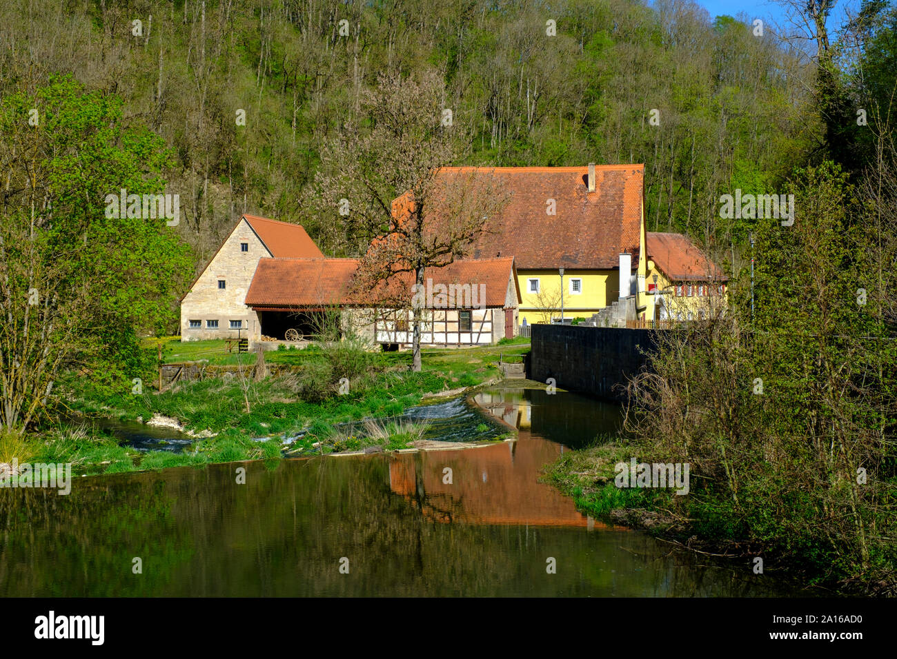 Tauber river and secluded houses in Tauber Valley, Rothenburg ob der Tauber, Bavaria, Germany Stock Photo