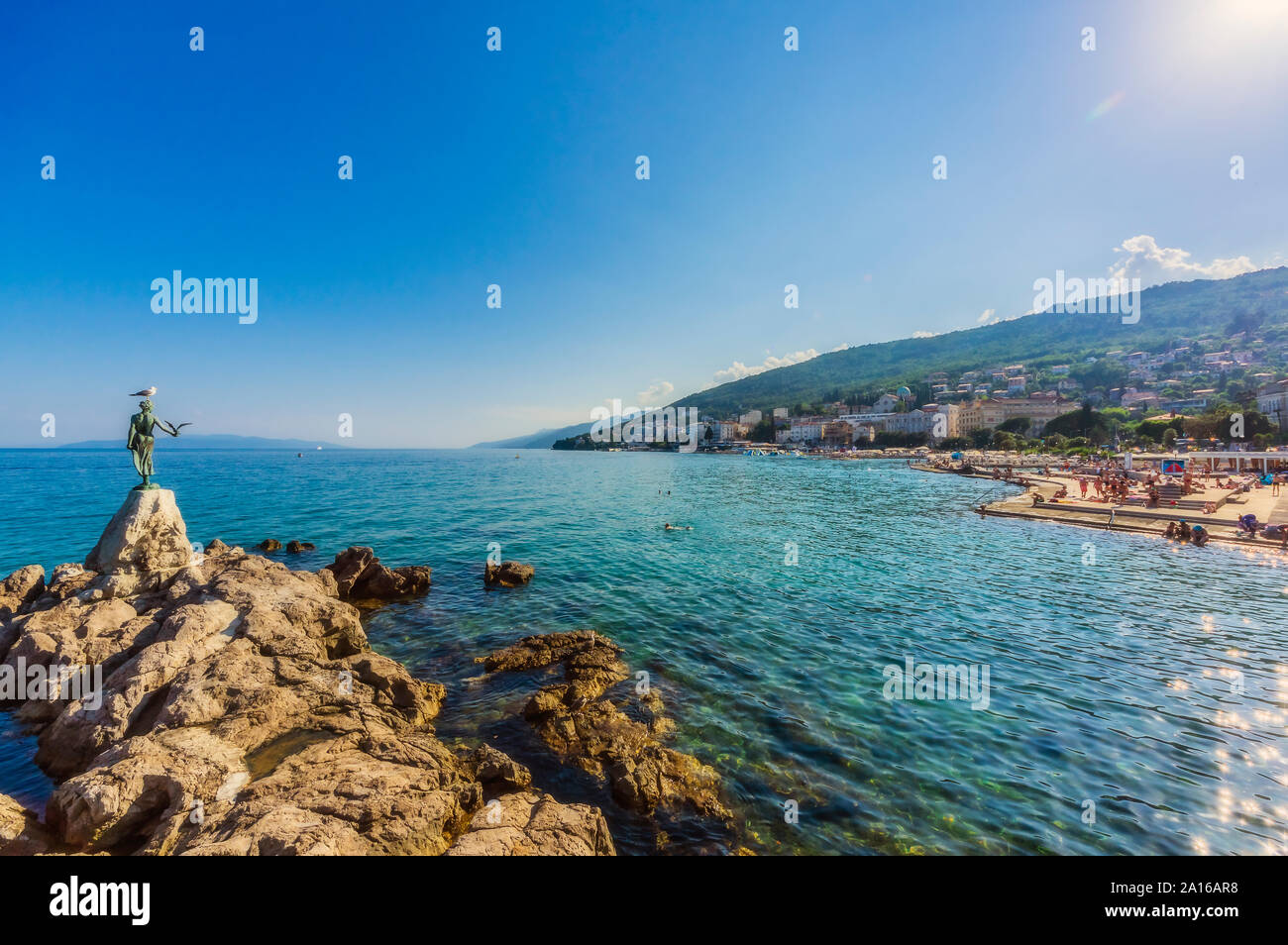 Opatija town at coast of Adriatic Sea against blue sky during sunny day Stock Photo