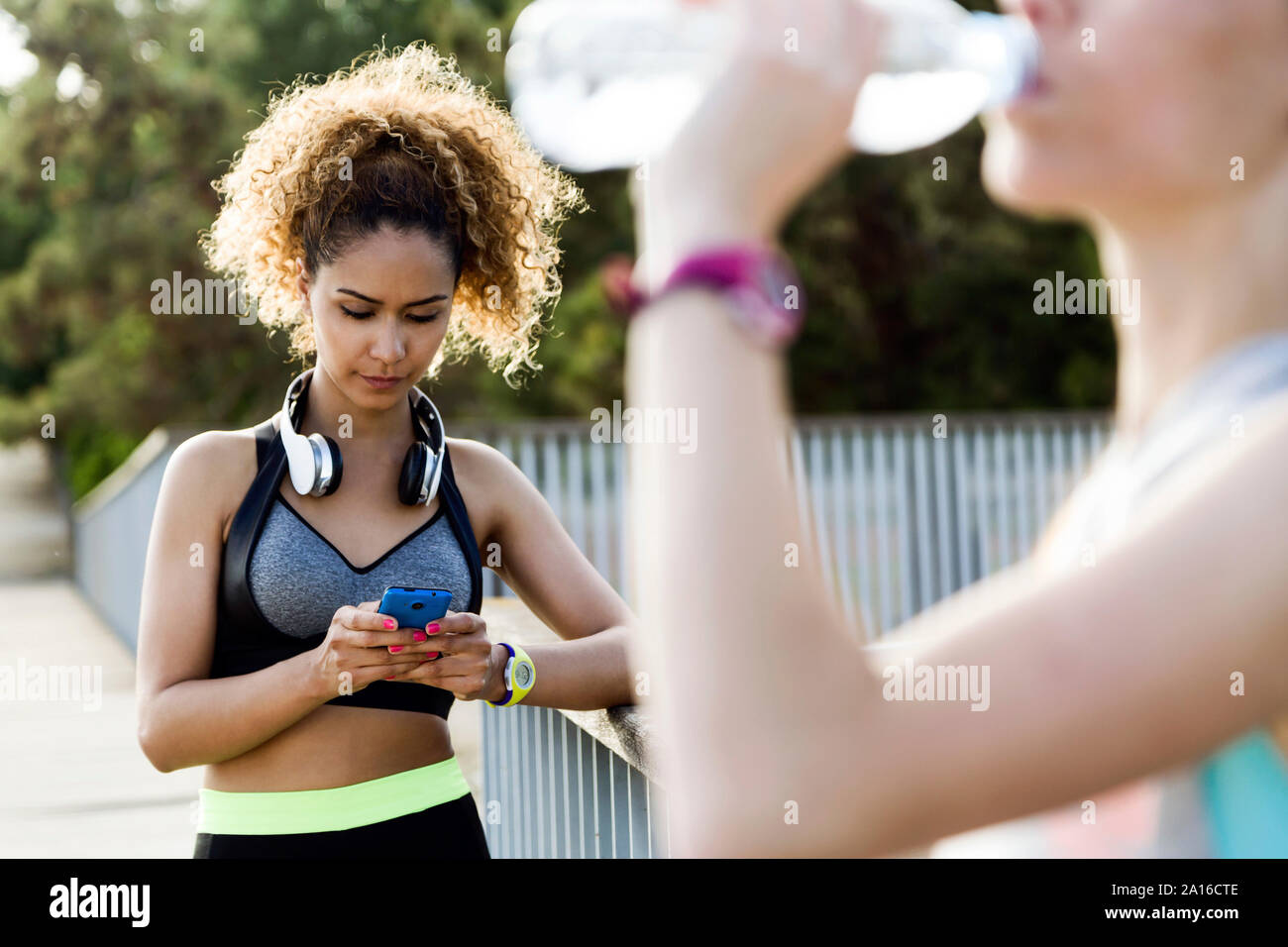 Two sporty young women finishing their workout Stock Photo