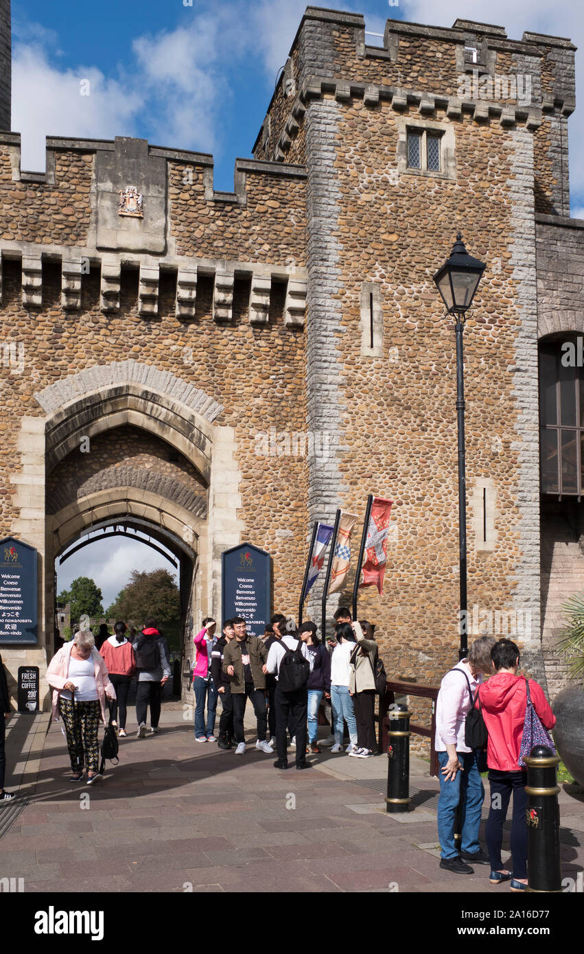 dh Cardiff Castle CARDIFF WALES Asian tourists with guide South gate entrance to castle exterior Stock Photo