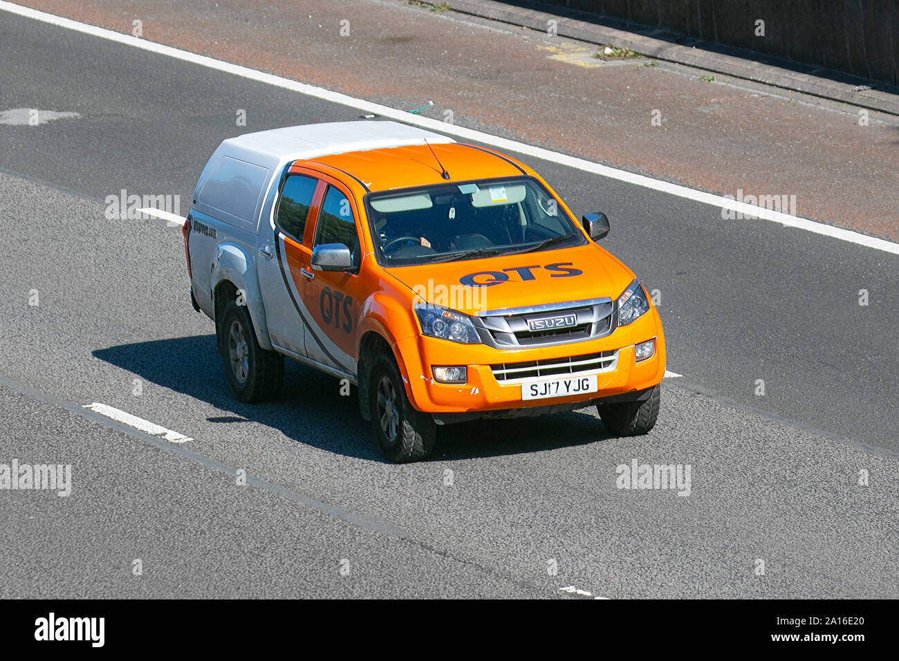 OTS orange Isuzu D-Max Eiger D/C Twin Turb; UK Vehicular traffic, transport, modern, saloon cars, south-bound on the 3 lane M6 motorway highway. Stock Photo