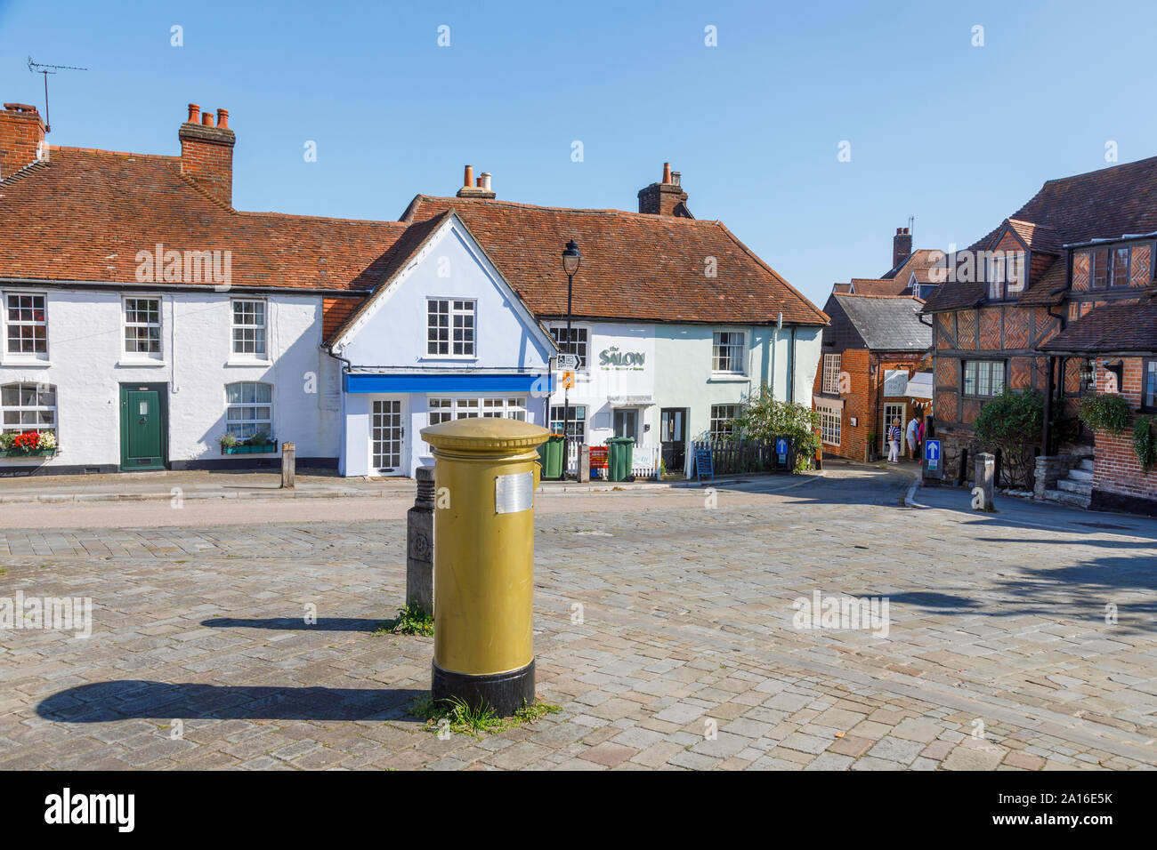Olympic Gold pillar box for cyclist Dani King in The Square in Hamble-le-Rice, a coastal village on the Solent, Hampshire, south coast England, UK Stock Photo