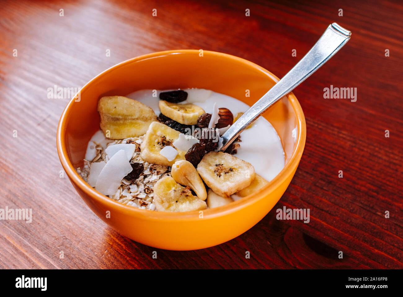 Healthy snacks - Cereals with dried fruits and yoghurt Stock Photo