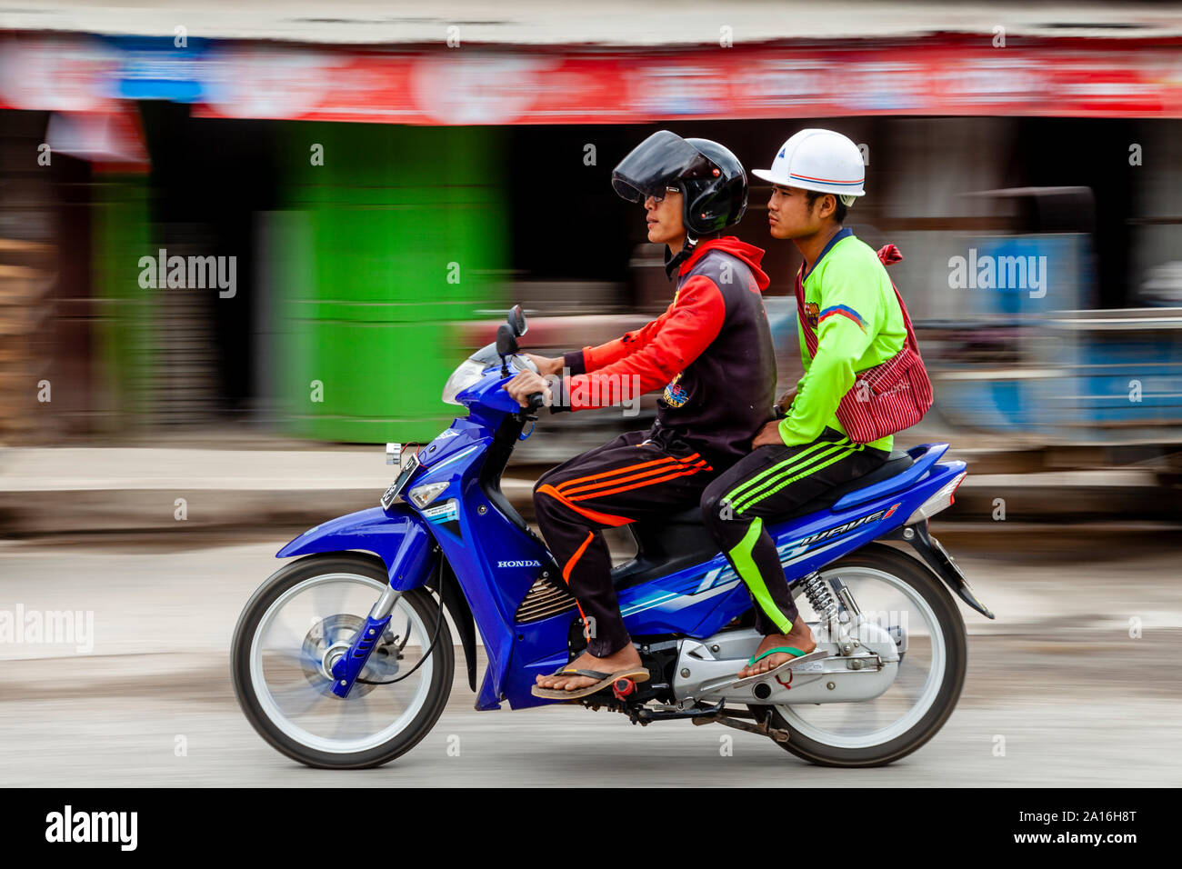 Two Young Men Riding A Motorcycle, Nyaung Shwe, Lake Inle, Shan State, Myanmar Stock Photo