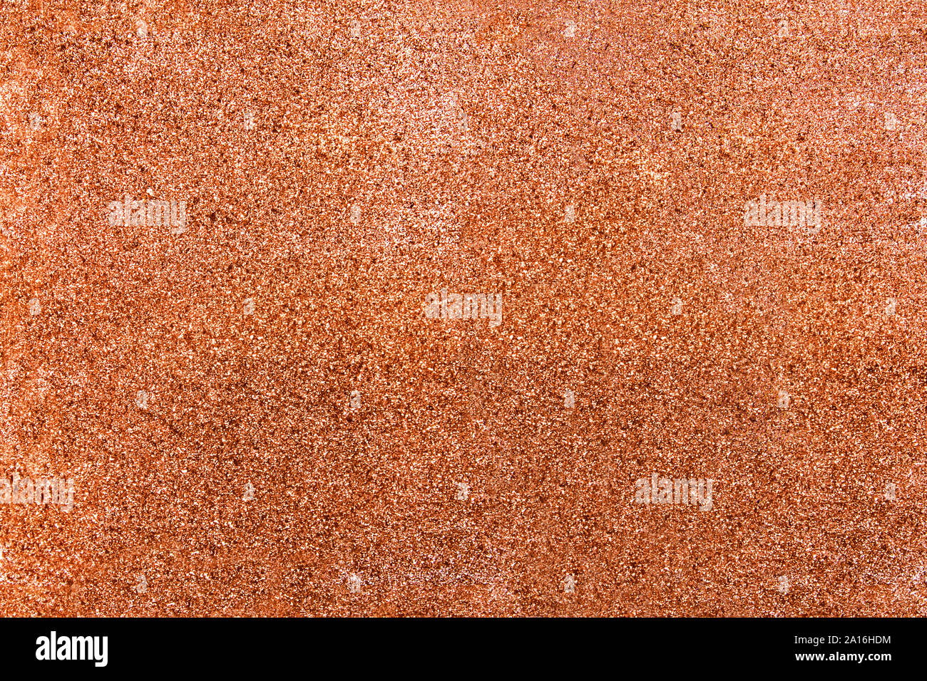 Texture with rose gold sparkles on surface. Stock Photo