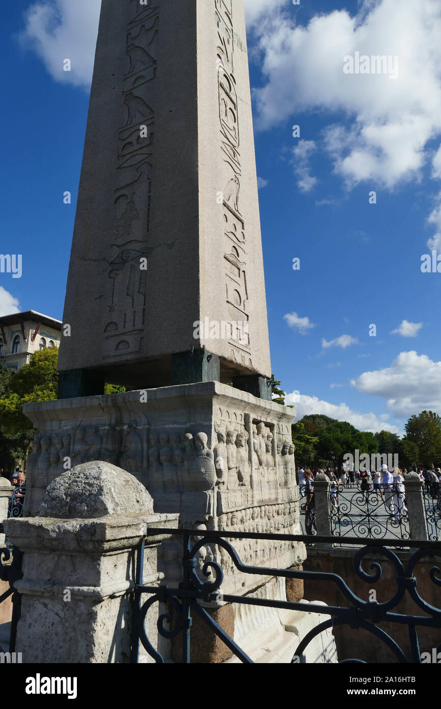 ISTANBUL, TURKEY  - SEP 6, 2019 - Tourists walk by the Egyptian obelisk in the ancient site of the Hippodrome   in Istanbul, Turkey Stock Photo