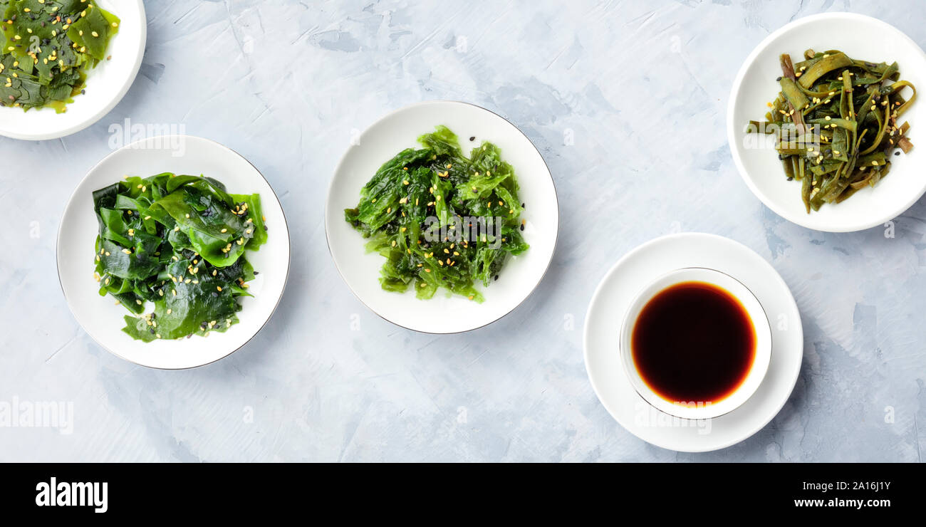 A panorama of seaweed, sea vegetables, with a sauce, top shot Stock Photo