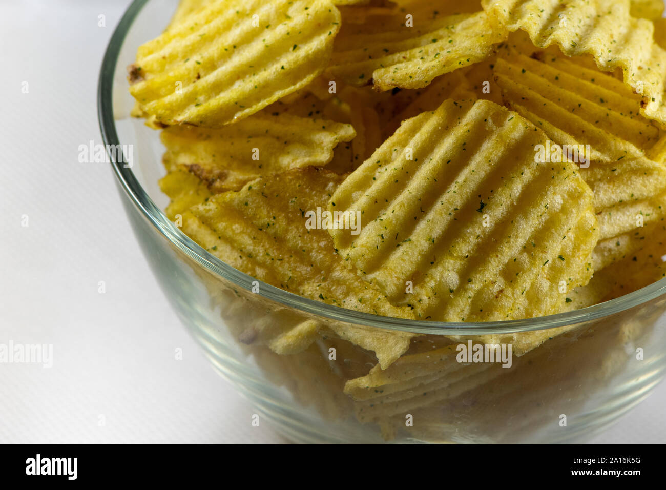 Macro photo of golden fried potato chips. Stock Photo