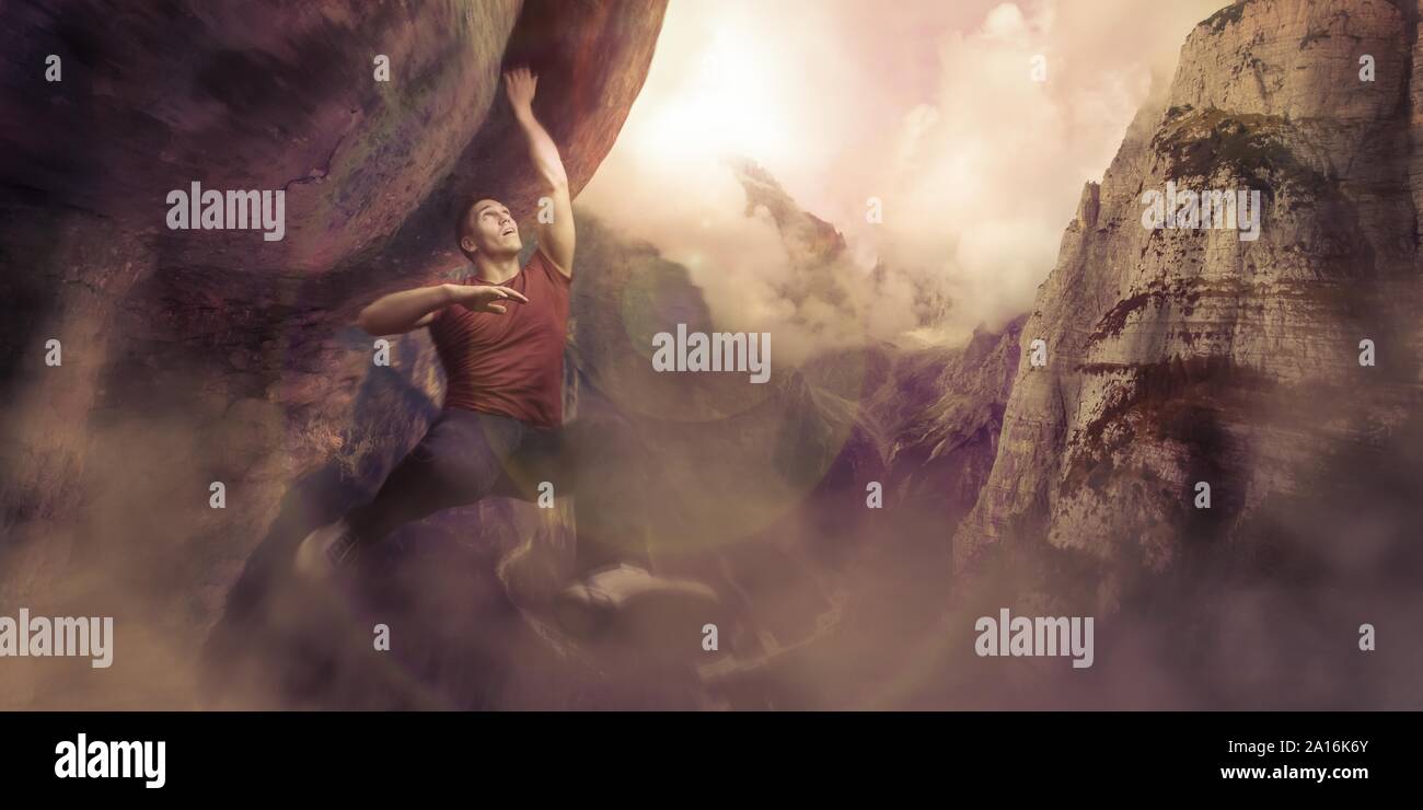 mountain climber hanging on a cliff on a mountain Stock Photo Alamy