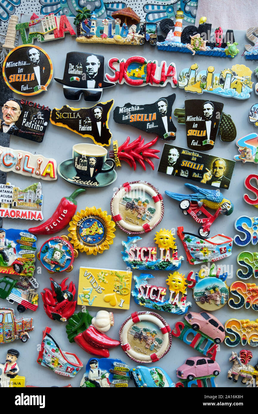 Close up image of a series of souvenirs magnets for fridge regarding Sicilian products and culture Stock Photo