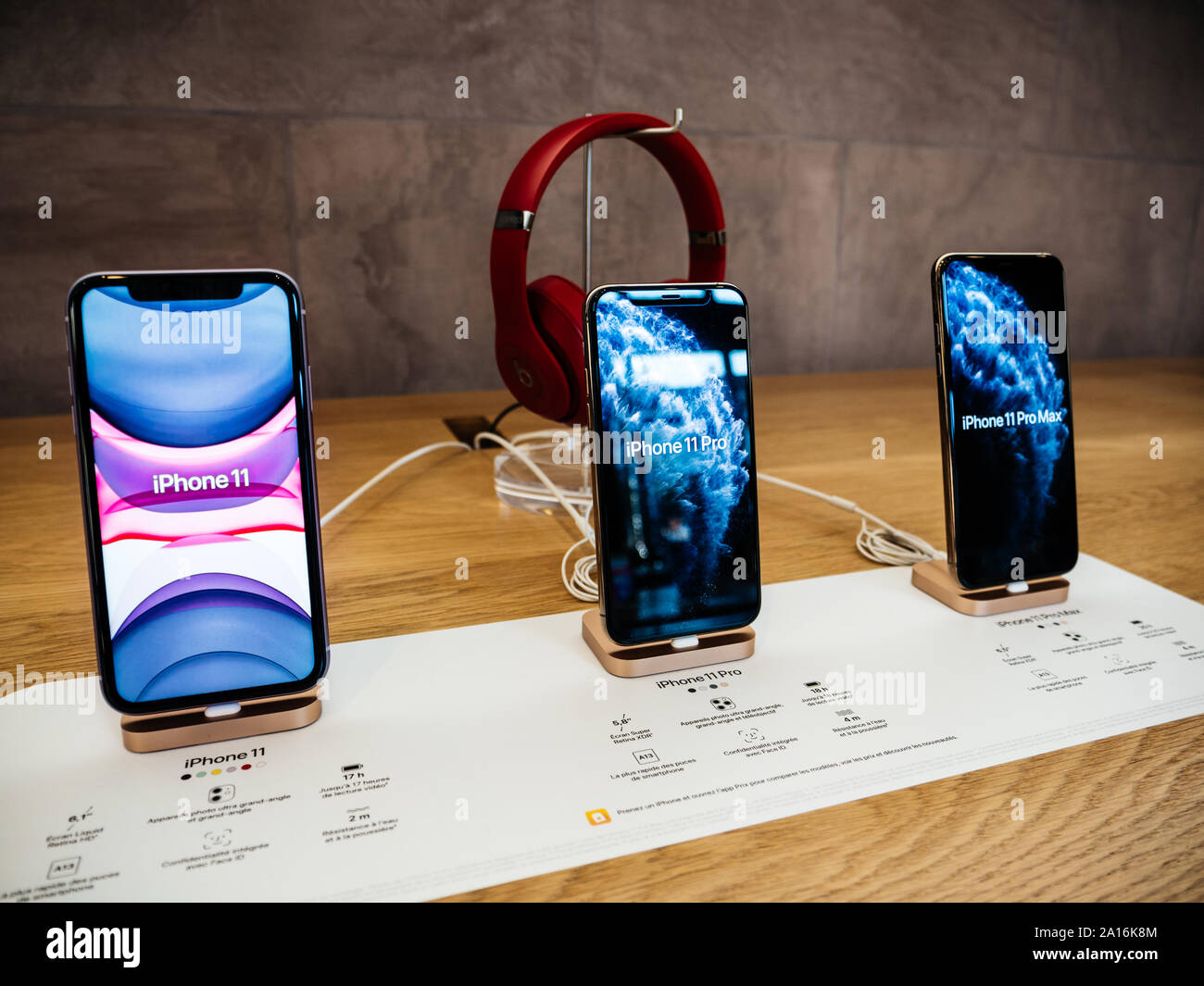Paris, France - Sep 20, 2019: The new iPhone 11, 11 Pro and Pro Max range displayed in Apple Store next to Beats by Dr Dre Headphones as the smartphone by Apple Computers goes on sale Stock Photo