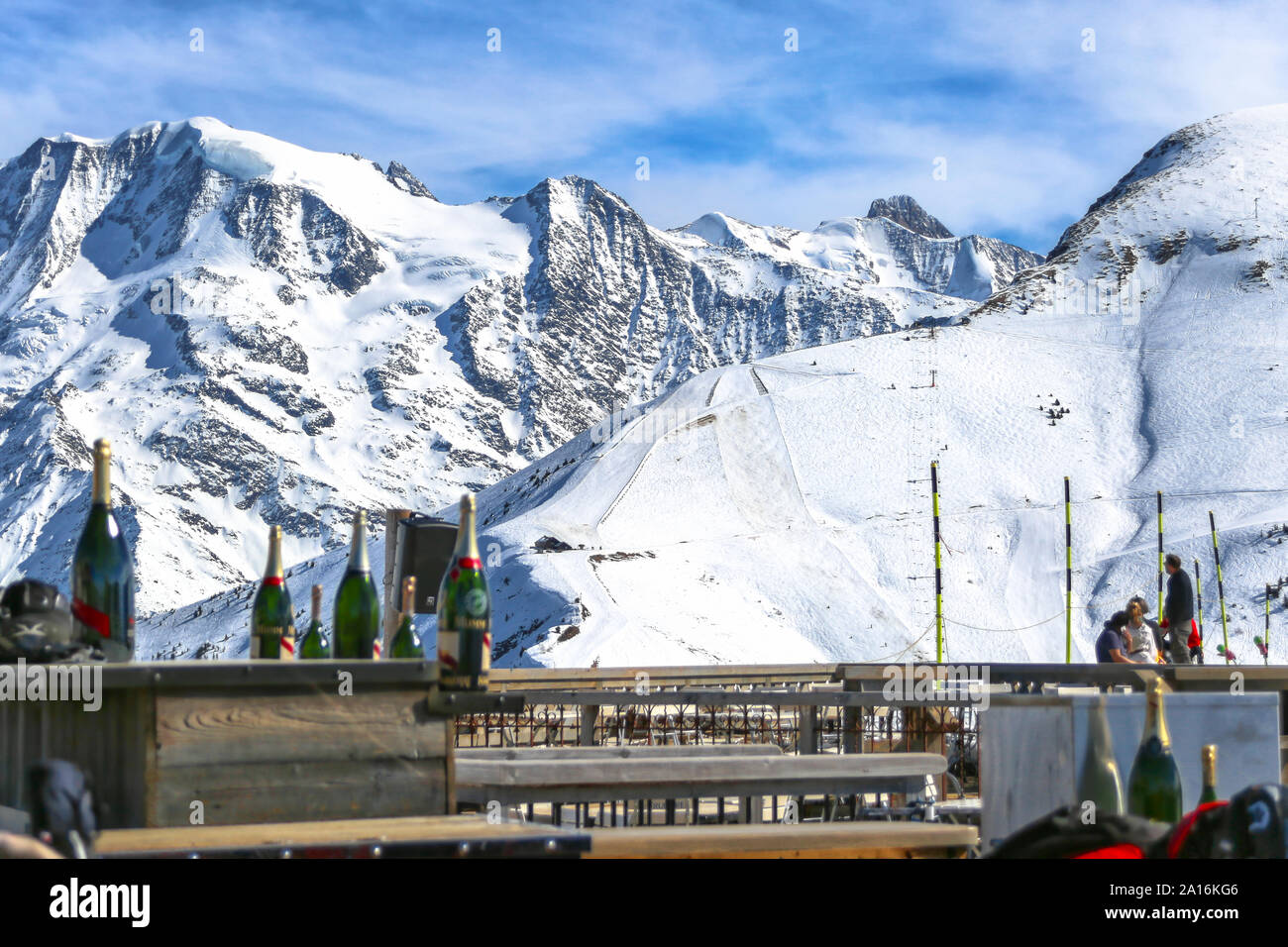 La Folie Douce Saint Gervais after ski restaurant with champagne bottles on the tables. Mont Blanc view in the back on a sunny day at Chamonix. Stock Photo