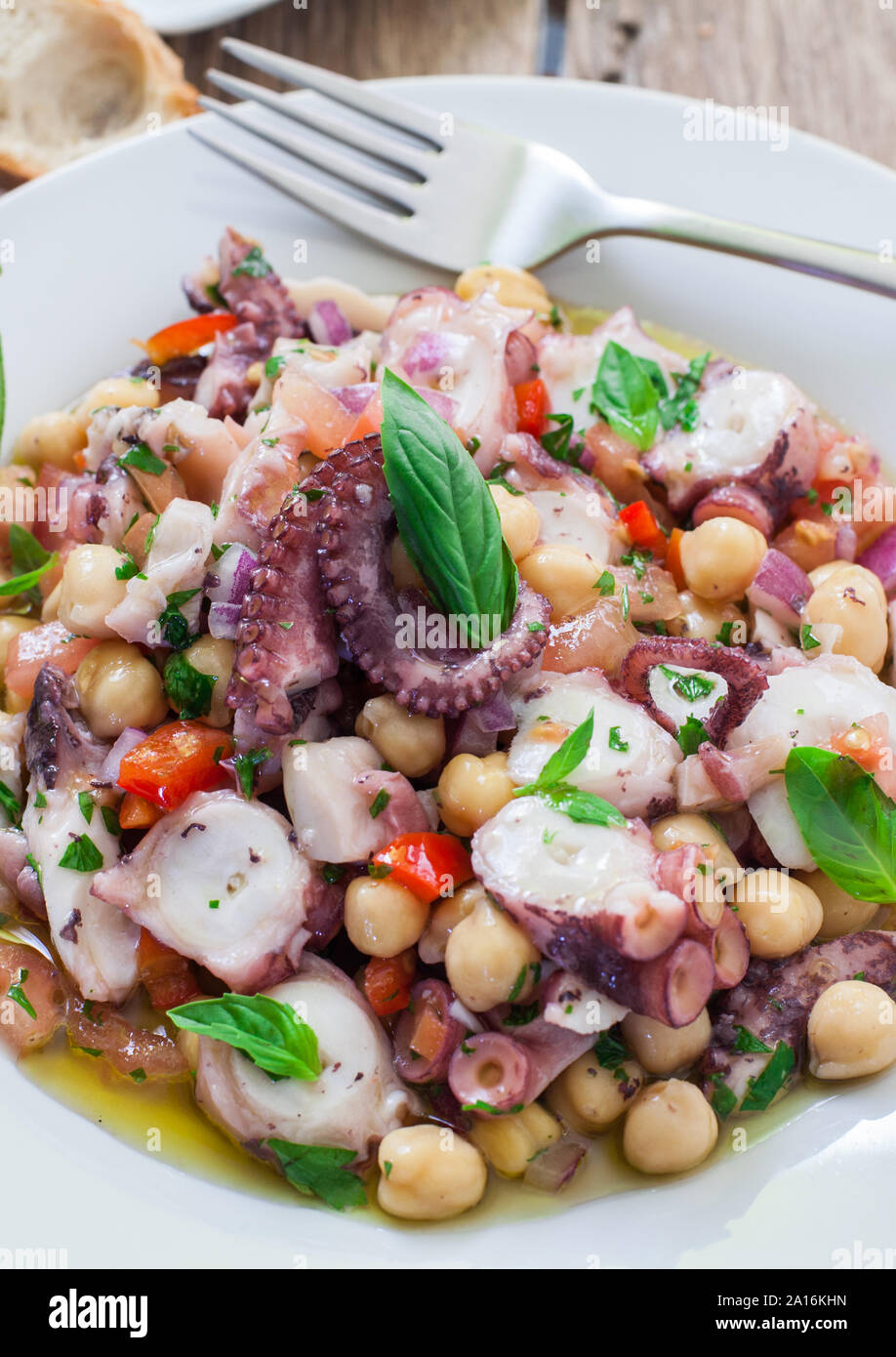 healthy octopus and chickpeas salad with veggies Stock Photo