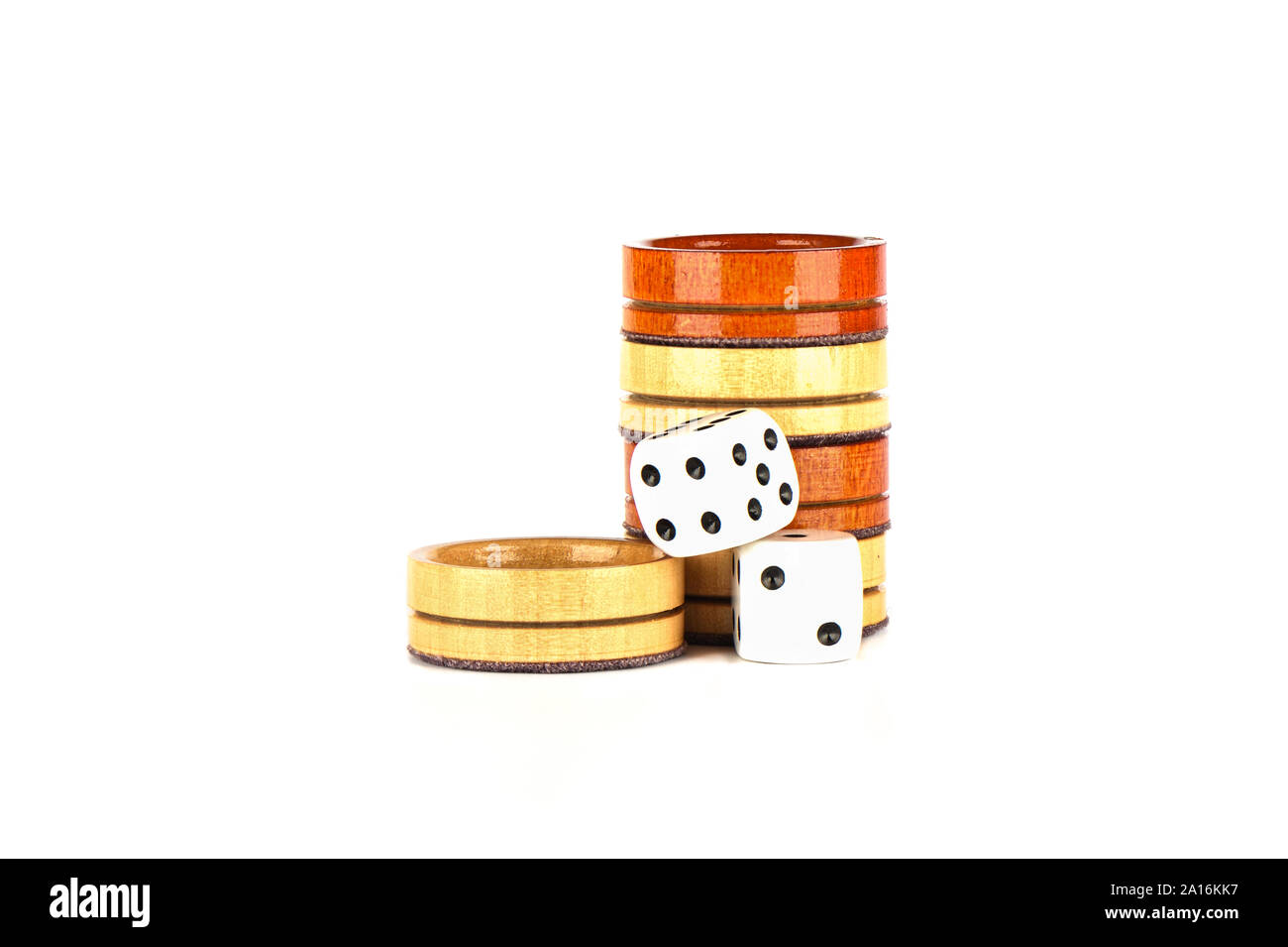 Dice and wooden backgammon checkers isolated on a white background. Copy space. Stock Photo
