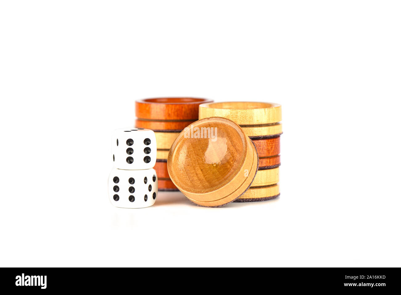 Dice and backgammon checkers isolated on a white background. Copy space. Stock Photo