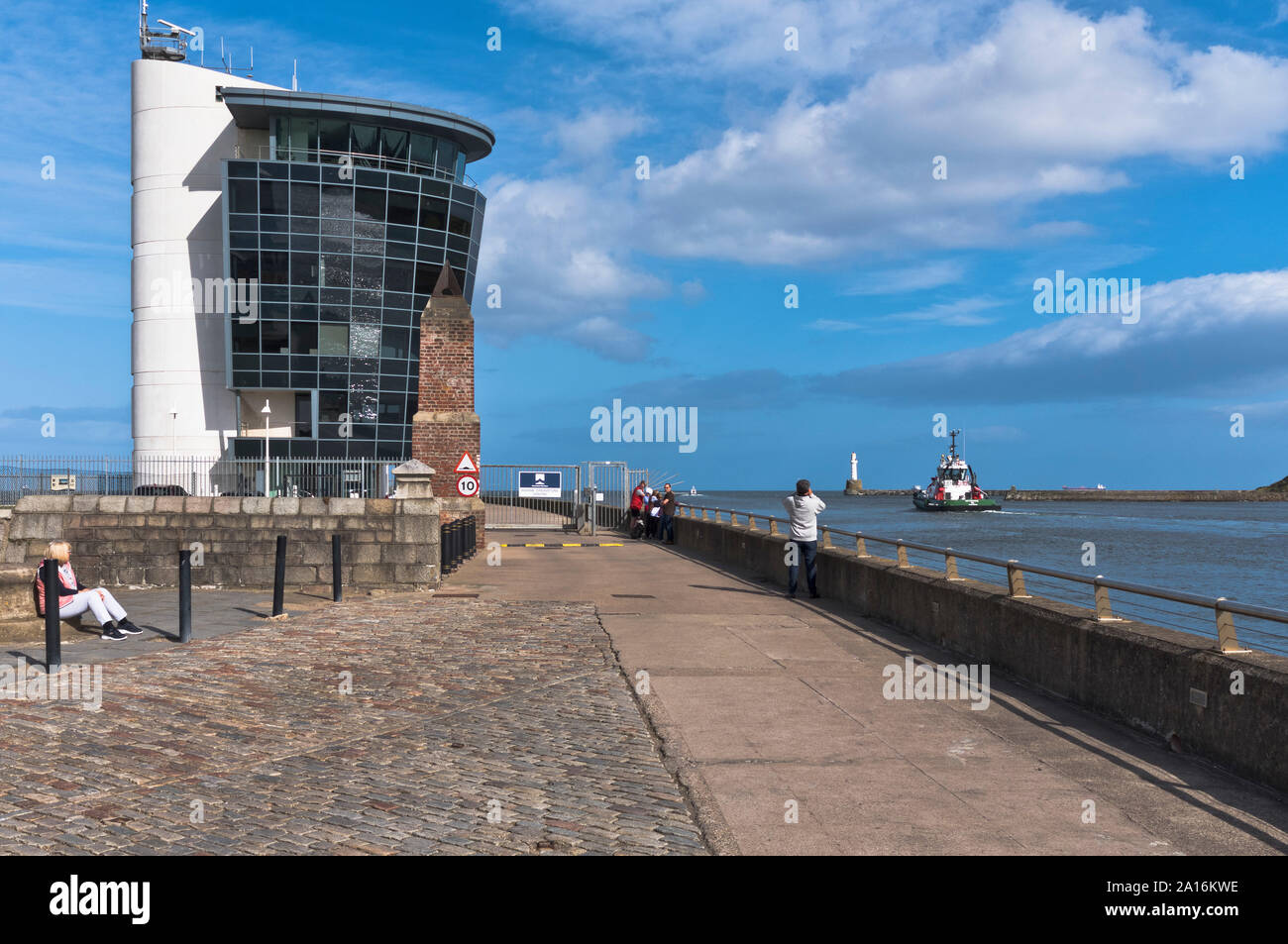 dh Harbour Masters building HARBOUR ABERDEEN Modern control tower harbours entrance tug leaving people footdee Stock Photo