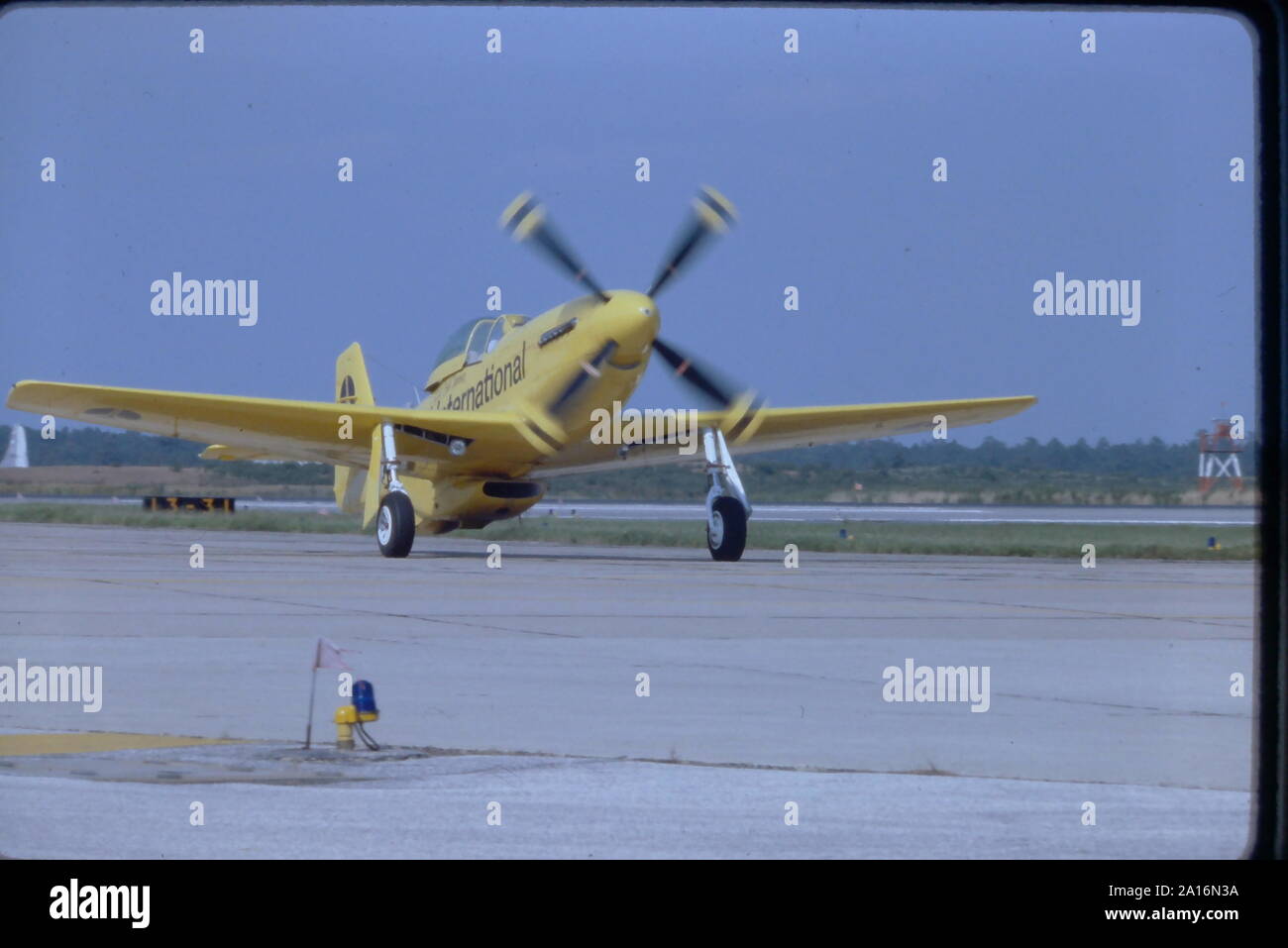 Bob Hoover, aerobatic pilot of world next to his bright yellow P-51 Mustang stunt plane. Hoover was a WW2 fighter pilot, flight instructor and air show pilot for nearly 50 years. Hoover passed away in 2016 at the age of 94. Hoover was known to put assorted civilian aircraft through their paces in aerobatic stunts. Stock Photo