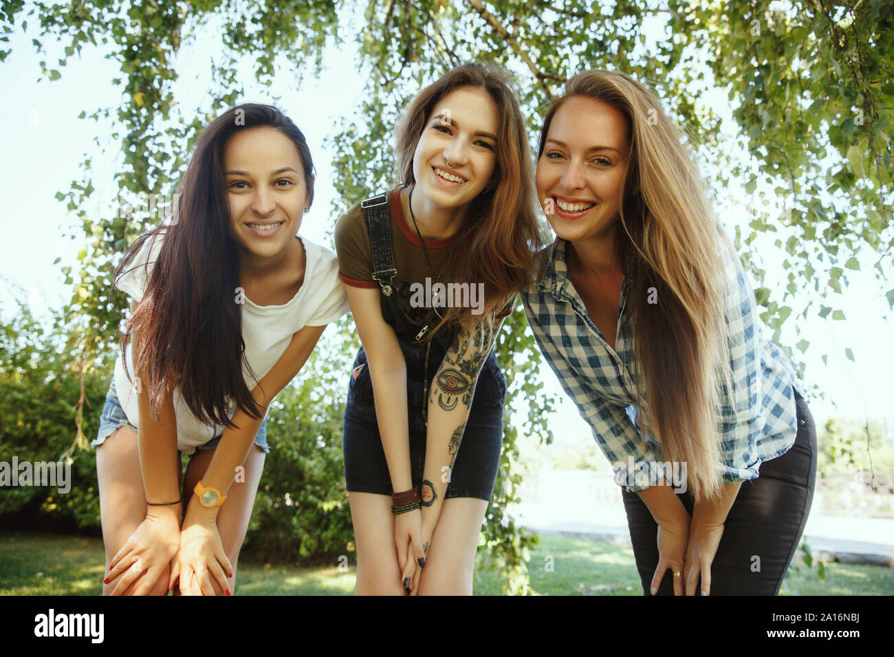 Different and happy in their bodies. Young women smiling, talking ...