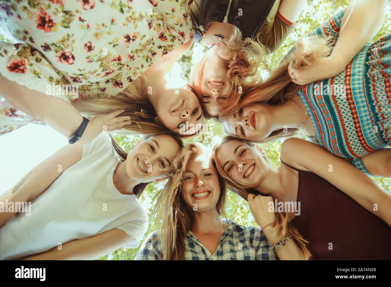 Different and happy in their bodies. Young women smiling, talking ...