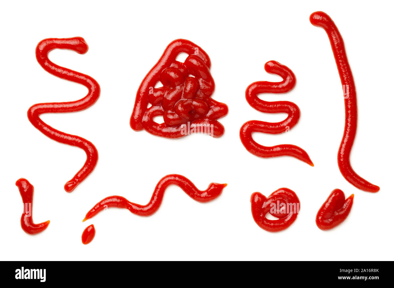 Ketchup splashes isolated on white background. Tomato sauce. Top view, flat lay Stock Photo