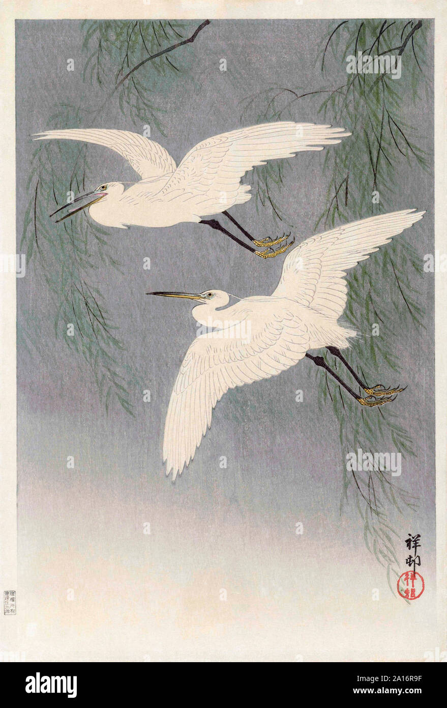 Two Little Egrets in Flight, by Japanese artist Ohara Koson, 1877 - 1945.  Ohara Koson was part of the shin-hanga, or new prints movement. Stock Photo