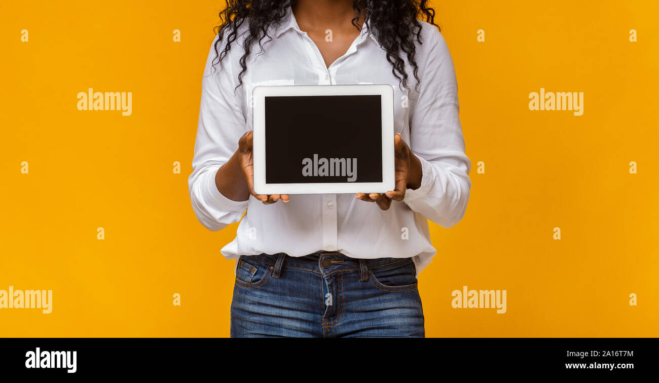 Black lady demonstrating blank digital tablet screen Stock Photo - Alamy