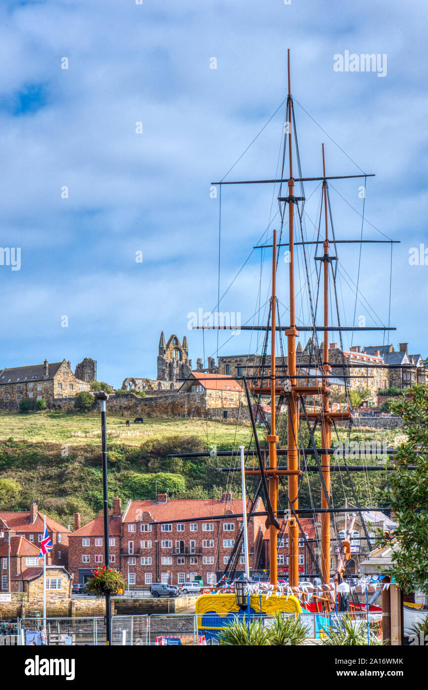 Whitby harbour with view to Whitby Abbey, North Yorkshire, UK Stock Photo