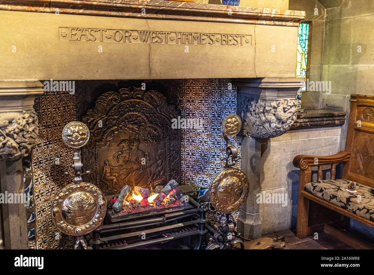 East or West Hames Best, carved stone fireplace, Cragside House, Northumberland, UK Stock Photo