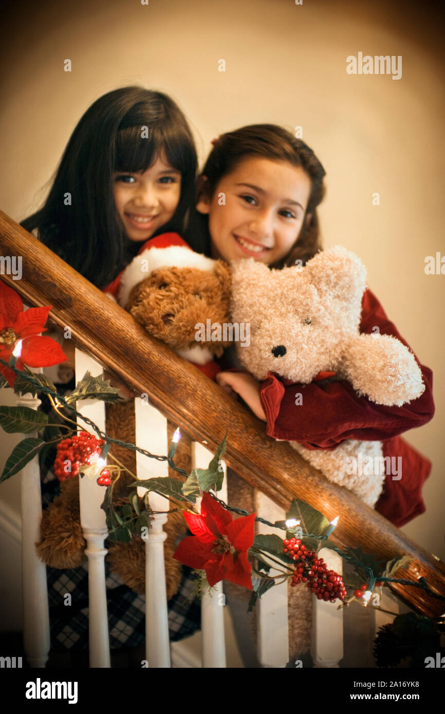 Two girls are merrymaking during Christmas. Stock Photo