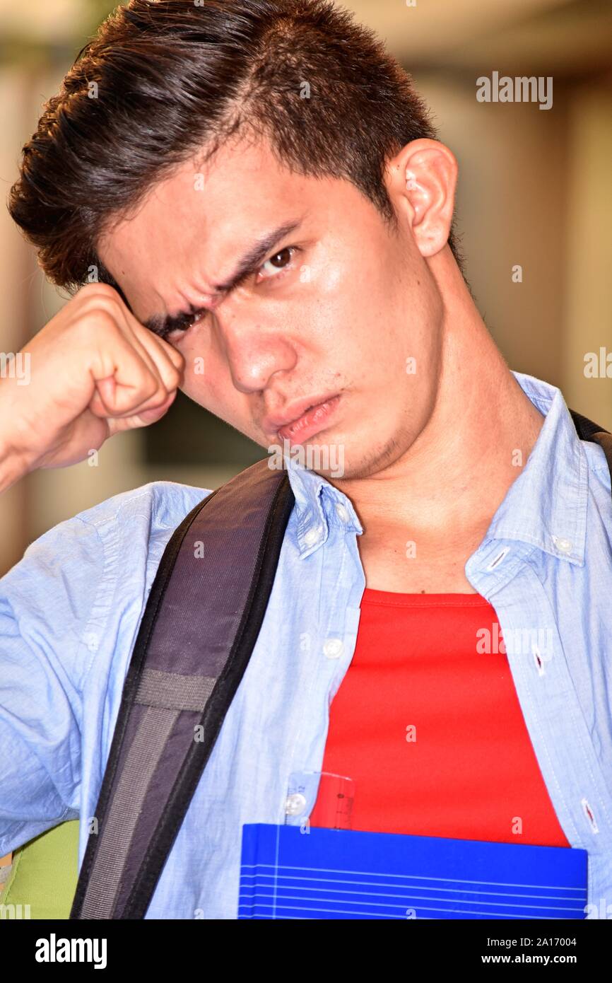 Confused Youthful Diverse Student With Books Stock Photo